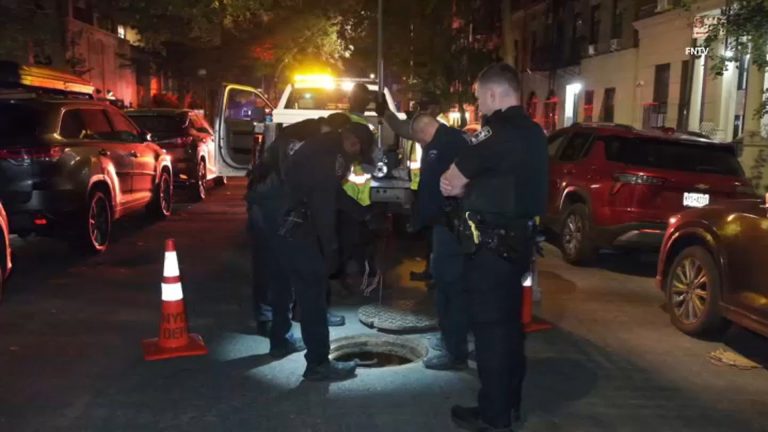 The sewer people are back. 5 seen climbing out of street hole on Upper East Side